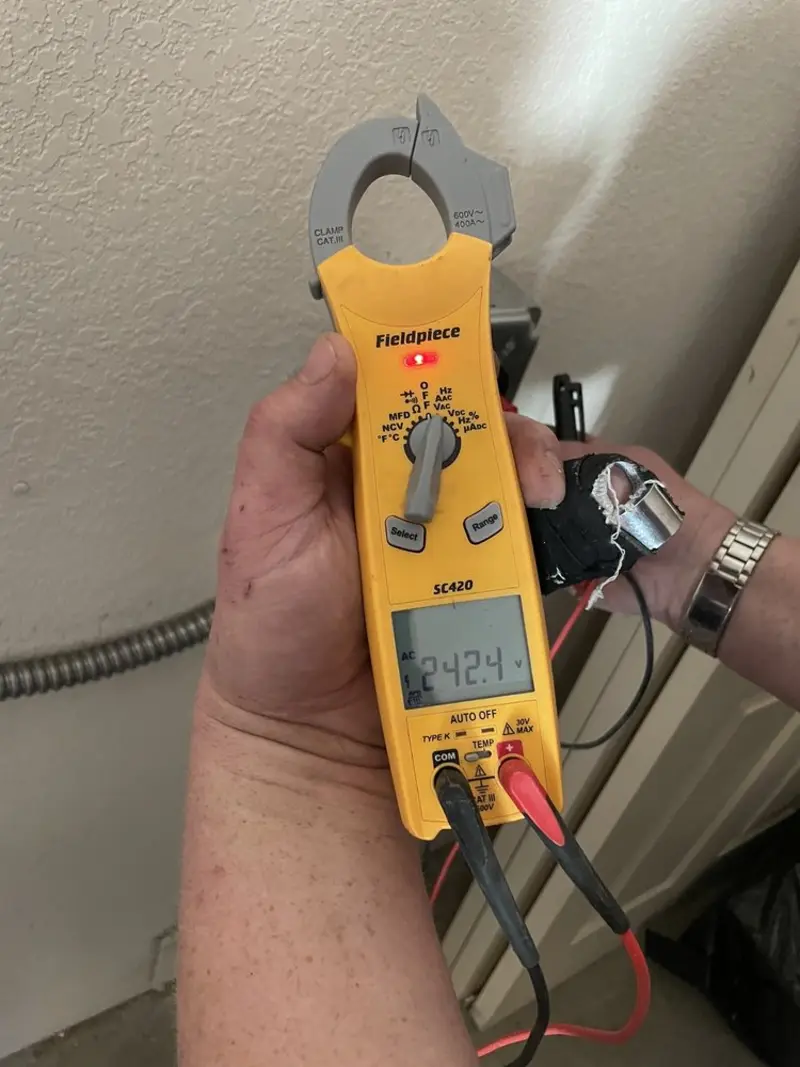 Voltage testing with clamp meter during Electrical Installation Services in Gorham